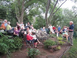 1654812265339 Neighborsgatherinthebackyardofdelpetersonshometolearnhowtheycanprotectlilyl 1654812265339 Neighborsgatherinthebackyardofdelpetersonshometolearnhowtheycanprotectlilyl