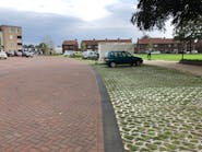 Interlocking brick (left) is one of the oldest forms of permeable paving, while a newer generation of concrete tiles can accommodate gravel or grass.