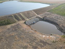 The team excavated the stilling basin and set rip rap along the bank and then set a new pipe riser for the new overflow pipe. The team excavated the stilling basin and set rip rap along the bank and then set a new pipe riser for the new overflow pipe.