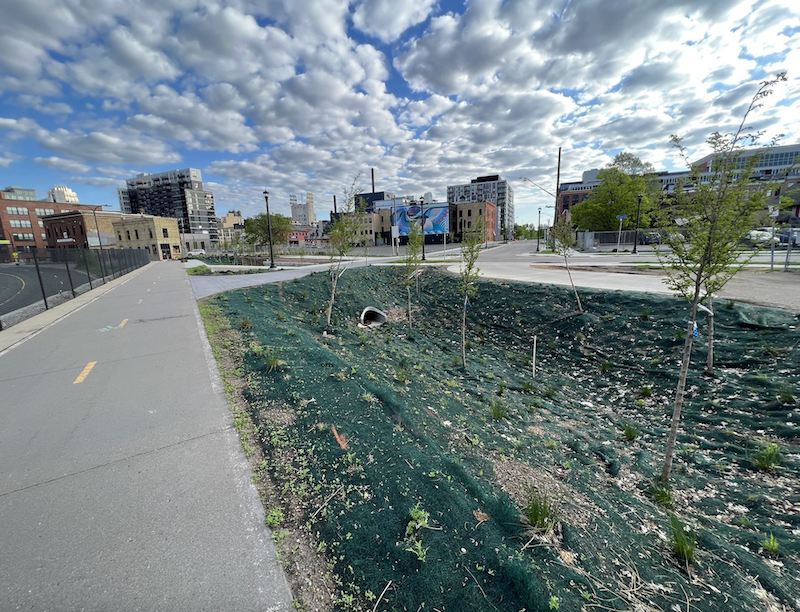 Planters and other green spaces were added to this area, enhancing the sidewalk and creating a bike trail connection.
