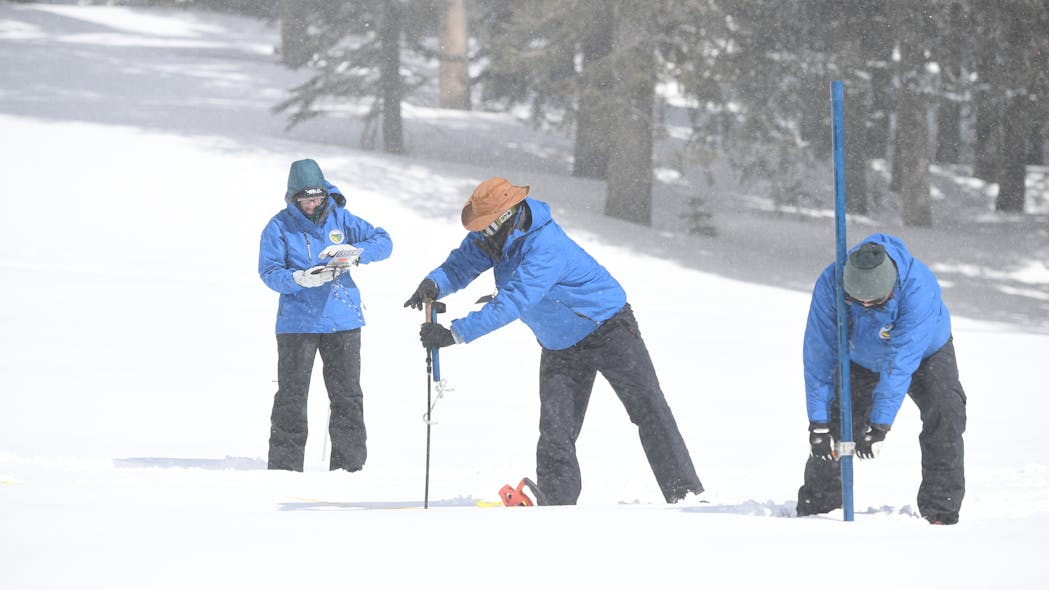 DWR staff conduct the fourth snow survey of the season at Phillips Station on April 3, 2023.
