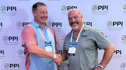 David M. Fink, PPI president (left) congratulates Rich Houle (right) of Reliance Worldwide for being named Member of the Year for the Building & Construction division.