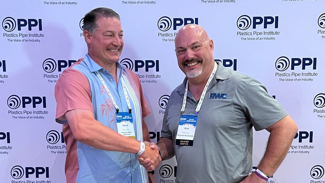 David M. Fink, PPI president (left) congratulates Rich Houle (right) of Reliance Worldwide for being named Member of the Year for the Building &amp; Construction division.