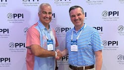 Daniel Currence (left), P.E. director of engineering PPI&rsquo;s Drainage Division congratulates Greg Baryluk (right) of Advanced Drainage Systems for being named Member of the Year for the division.