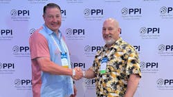 David M. Fink (left), president PPI, congratulates Chris Ampfer (right) of WL Plastics for being named Member of the Year for the Energy Piping Systems Division of PPI.