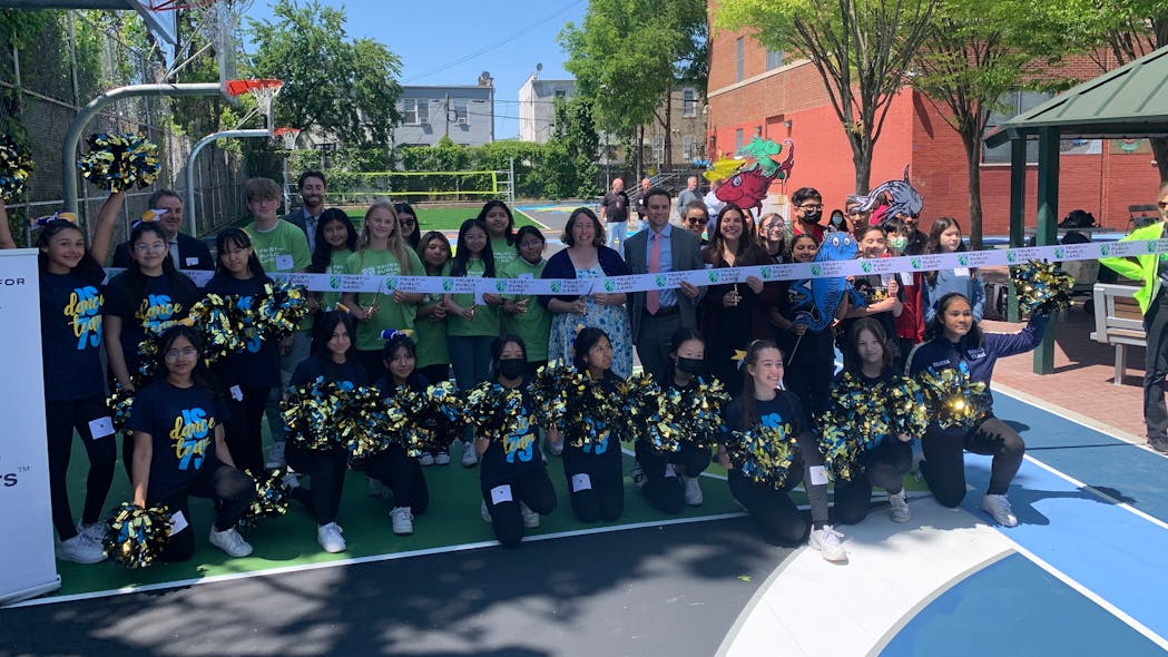 The newly renovated schoolyard features two turf fields, forest walk, running track, and green infrastructure to absorb stormwater runoff and reduce neighborhood flooding.