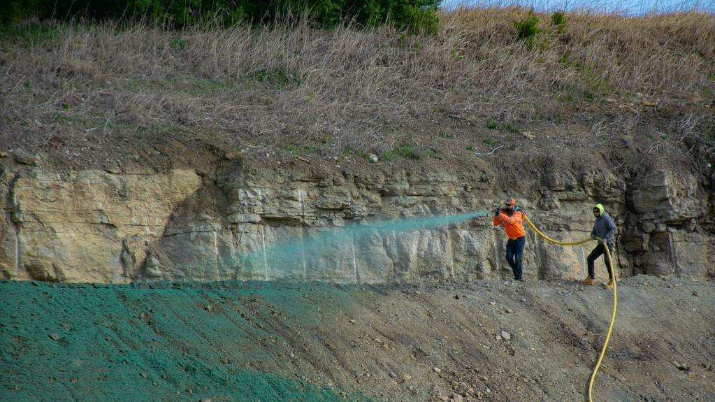 Five of the eight acres were 2 to 1 slopes, which were over sprayed with the canon after the slopes were hosed with three-man crews.