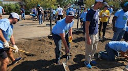 MWRD Commissioner Daniel Pogorzelski shovels soil during the construction of the O.A. Thorps Scholastic Academy rain garden. MWRD Commissioner Daniel Pogorzelski shovels soil during the construction of the O.A. Thorps Scholastic Academy rain garden.