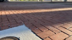 Gaps between the pavers, filled with chip stone, allow stormwater to flow freely underneath the pavers. Gaps between the pavers, filled with chip stone, allow stormwater to flow freely underneath the pavers.