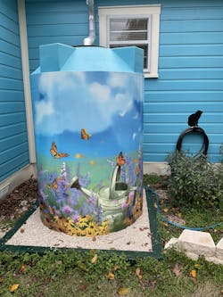 Art transforms the cistern into a Day Brightener, yet fully functioning to collect rainwater.
