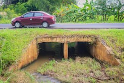 A reinforced concrete box culvert running under an embankment. A reinforced concrete box culvert running under an embankment.