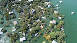 Aerial drone view entire neighborhood under water major flooding in Central Texas. Aerial drone view entire neighborhood under water - near Austin Texas at Lake Travis historic flooding of October 2018 causes evacuations and flooded homes. (Photo and caption credit: Bryan Roschetzky, Dreamstime) Aerial drone view entire neighborhood under water major flooding in Central Texas. Aerial drone view entire neighborhood under water - near Austin Texas at Lake Travis historic flooding of October 2018 causes evacuations and flooded homes. (Photo and caption credit: Bryan Roschetzky, Dreamstime)