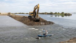 Kris Tjernell, (former) California Department of Water Resources (DWR) Deputy Director of Integrated Watershed Management kayaks through a levee breach. DWR and Ecosystem Investment Partners (EIP) hold a levee breaching ceremony to celebrate the completion of the Lookout Slough Tidal Habitat Restoration Project in Solano County. The levee will be breached in nine places, creating an open water habitat for fish and wildlife in the Sacramento-San Joaquin Delta. Photo taken September 18, 2024. Kris Tjernell, (former) California Department of Water Resources (DWR) Deputy Director of Integrated Watershed Management kayaks through a levee breach. DWR and Ecosystem Investment Partners (EIP) hold a levee breaching ceremony to celebrate the completion of the Lookout Slough Tidal Habitat Restoration Project in Solano County. The levee will be breached in nine places, creating an open water habitat for fish and wildlife in the Sacramento-San Joaquin Delta. Photo taken September 18, 2024.