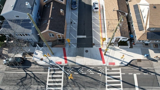 The project continues a shared sidewalk design that was first implemented in phase one, with new storm sewers, curbs, pedestrian ramps, signage and crosswalks. Photo credit: NYC DEP.