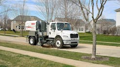Elgin RegenX1 sweeping a street in a residential neighborhood. Elgin RegenX1 sweeping a street in a residential neighborhood.