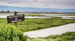 Restoration sign in the wetlands in Alviso Marsh, Don Edwards wildlife refuge, south San Francisco bay, California