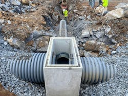 The underground stormwater management system has two separate units, both constructed using 60-inch diameter thermoplastic pipe, that connect to convey water into Antietam Creek at a controlled rate. The underground stormwater management system has two separate units, both constructed using 60-inch diameter thermoplastic pipe, that connect to convey water into Antietam Creek at a controlled rate.