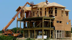Construction workers building a beachfront home at the Outer Banks of North Carolina Construction workers building a beachfront home at the Outer Banks of North Carolina