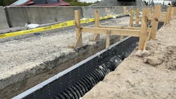 ADS slotted high-density polyethylene (HDPE) pipe was used between the express and general use lanes to handle runoff and mitigate hydroplaning. ADS slotted high-density polyethylene (HDPE) pipe was used between the express and general use lanes to handle runoff and mitigate hydroplaning.