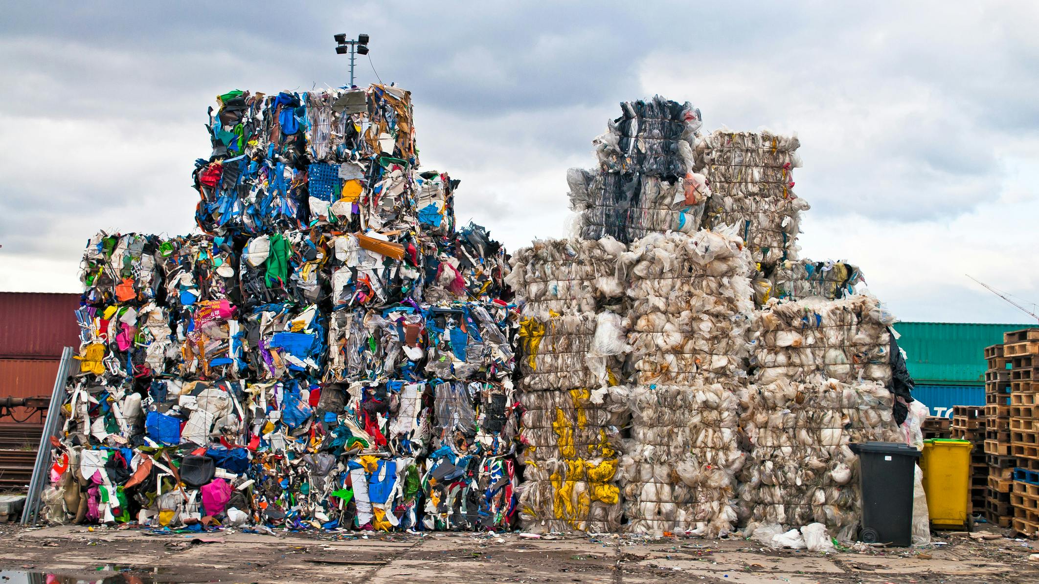 Piles of colorful plastic waste on a recycling site