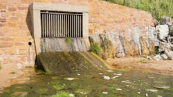 Storm drain outflow onto a beach Storm drain outflow onto a beach