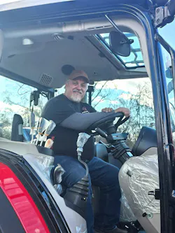 Richard Varona, owner of Warrenton Equipment, aboard one of the tractors now able to park on solid land converted from an open pond using Lane underground stormwater collection chambers. Richard Varona, owner of Warrenton Equipment, aboard one of the tractors now able to park on solid land converted from an open pond using Lane underground stormwater collection chambers.