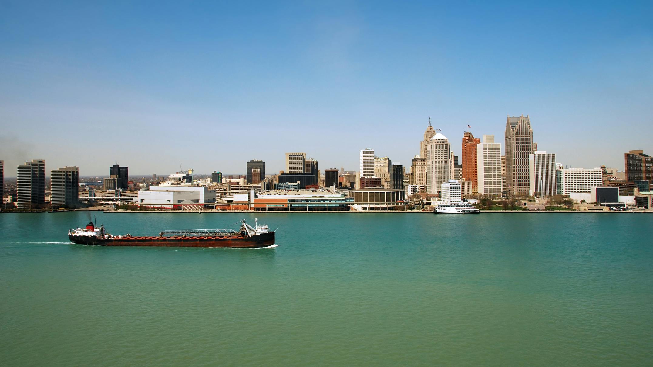 Coastal view of Detroit skyline with cargo barge 4