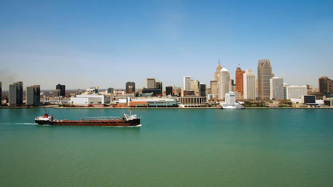 Coastal view of Detroit skyline with cargo barge 4