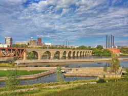 The Stone Arch Bridge, built in 1883, spans the Mississippi River in downtown Minneapolis. The bridge is a former railway crossing now used by pedestrians and cyclists, offering views of St. Anthony Falls.