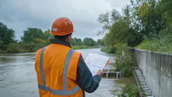 A water resources engineer examines flood control systems